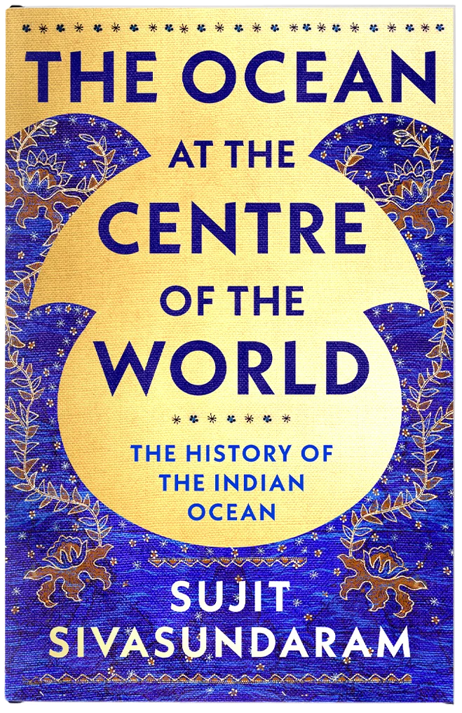 The cover features Indonesian tapestry decorations and wave like graphic shapes above a gold foil background.